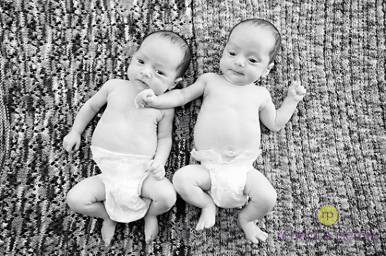 On the two blankets that Mom knitted for them...so sweet!