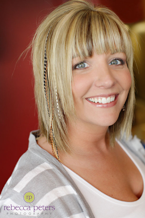 Here's our stylist, Ashley sporting her feathers!