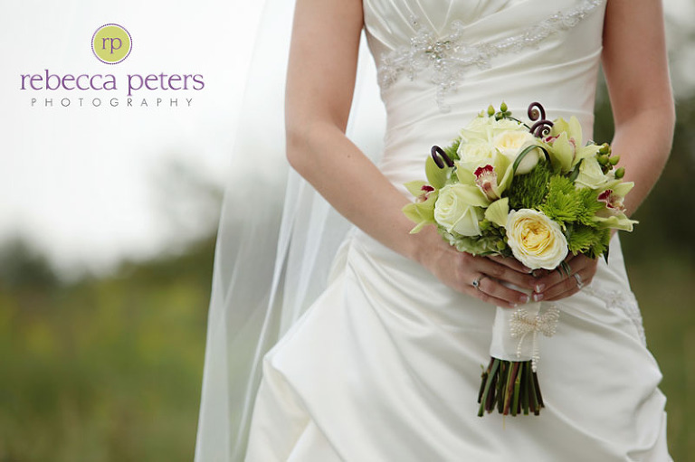 love the family jewelry on her bouquet